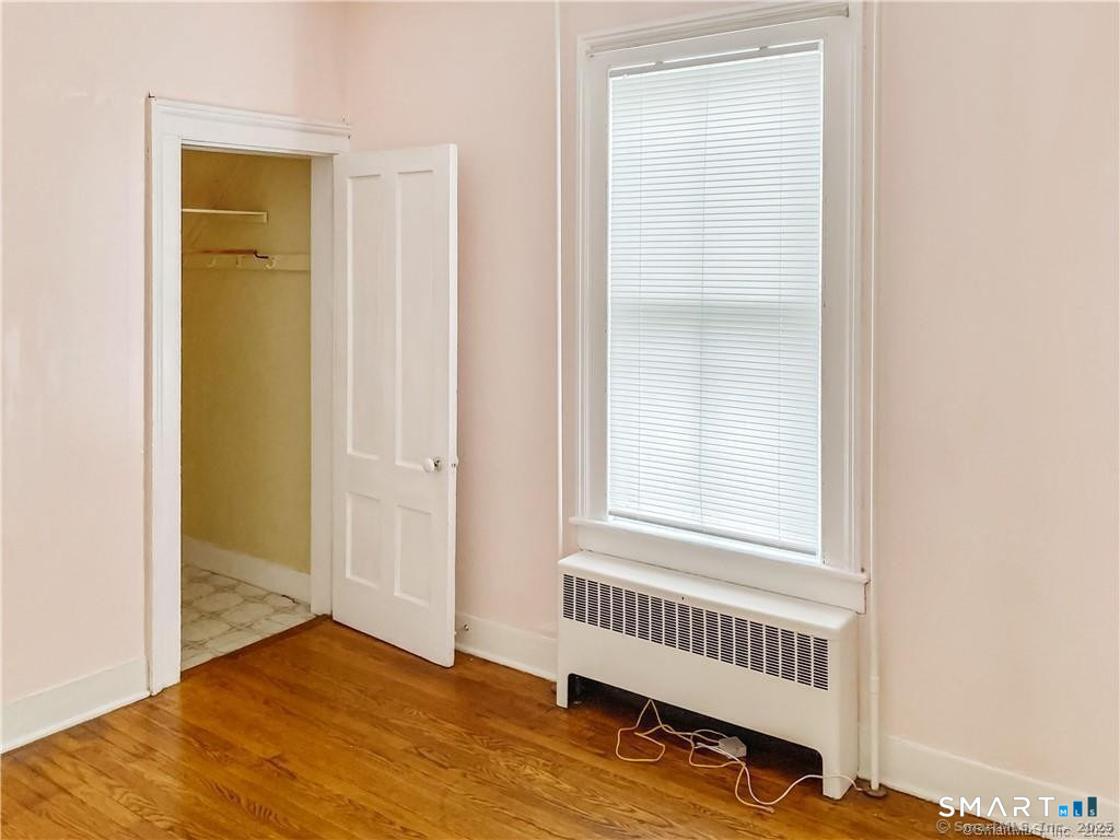 10 Wall Street Middletown, CT 06457 - Photo 7 of 10 a view of an empty room with wooden floor and a window