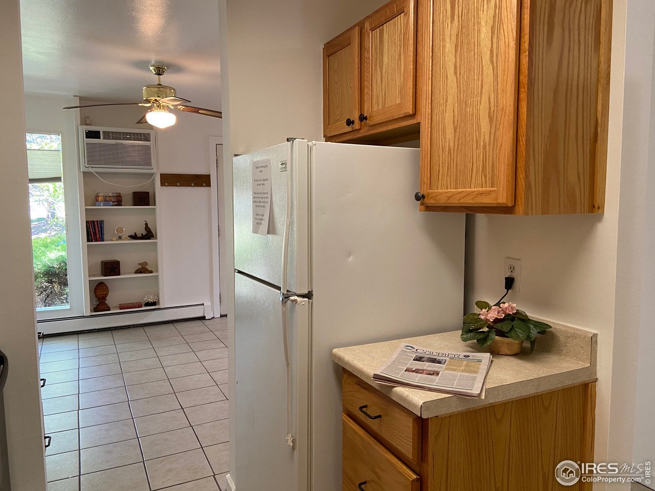 8060 Niwot Road, Unit 12E Niwot, CO 80503 - Photo 12 of 36 a kitchen with a refrigerator and a sink