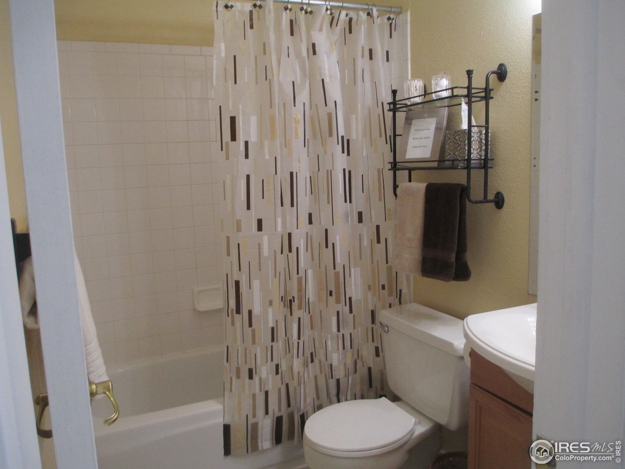 8060 Niwot Road, Unit 12E Niwot, CO 80503 - Photo 13 of 36 a white toilet sitting next to a bathroom sink