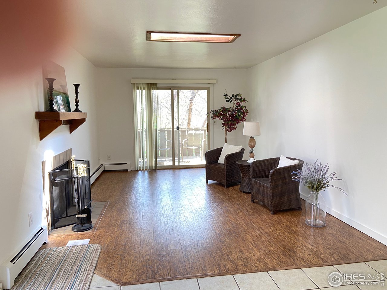 8060 Niwot Road, Unit 12E Niwot, CO 80503 - Photo 4 of 36 a living room with furniture and a wooden floor