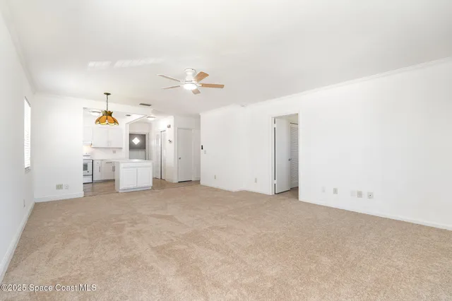 an empty room with a window and a fireplace