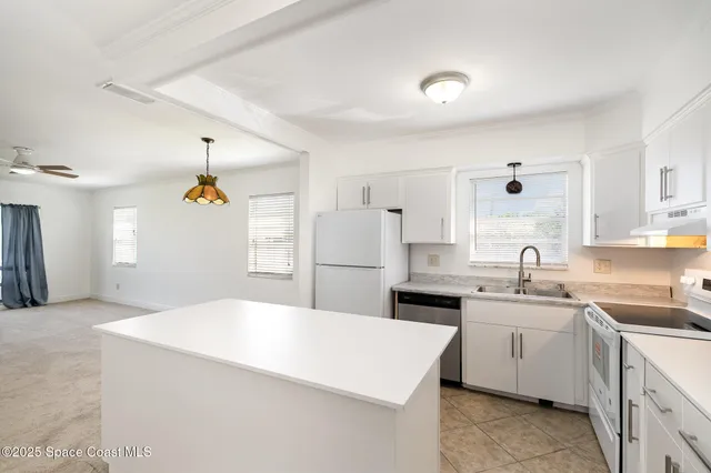 a view of a dining room and chandelier