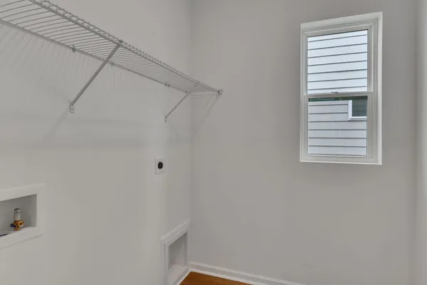 a view of a small space with racks on the wall