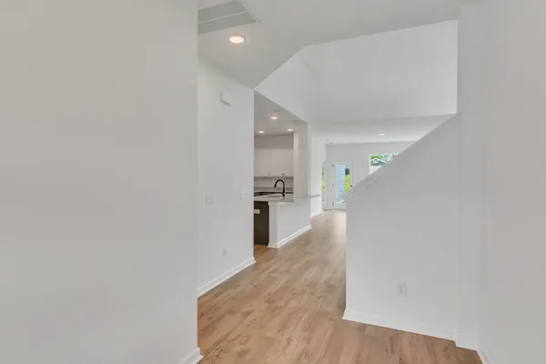 a view of a hallway with stairs