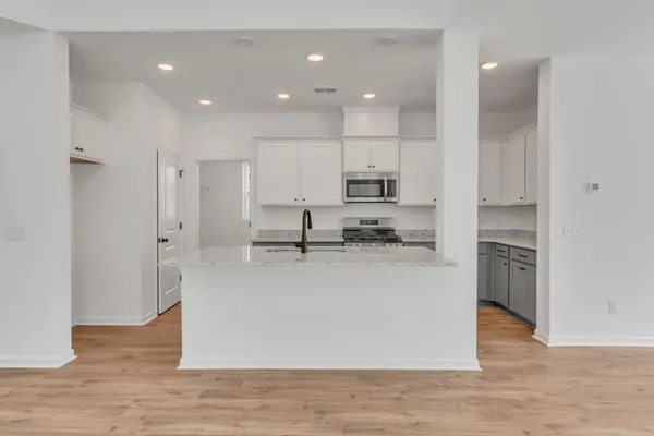 a view of kitchen with stainless steel appliances refrigerator oven and stove