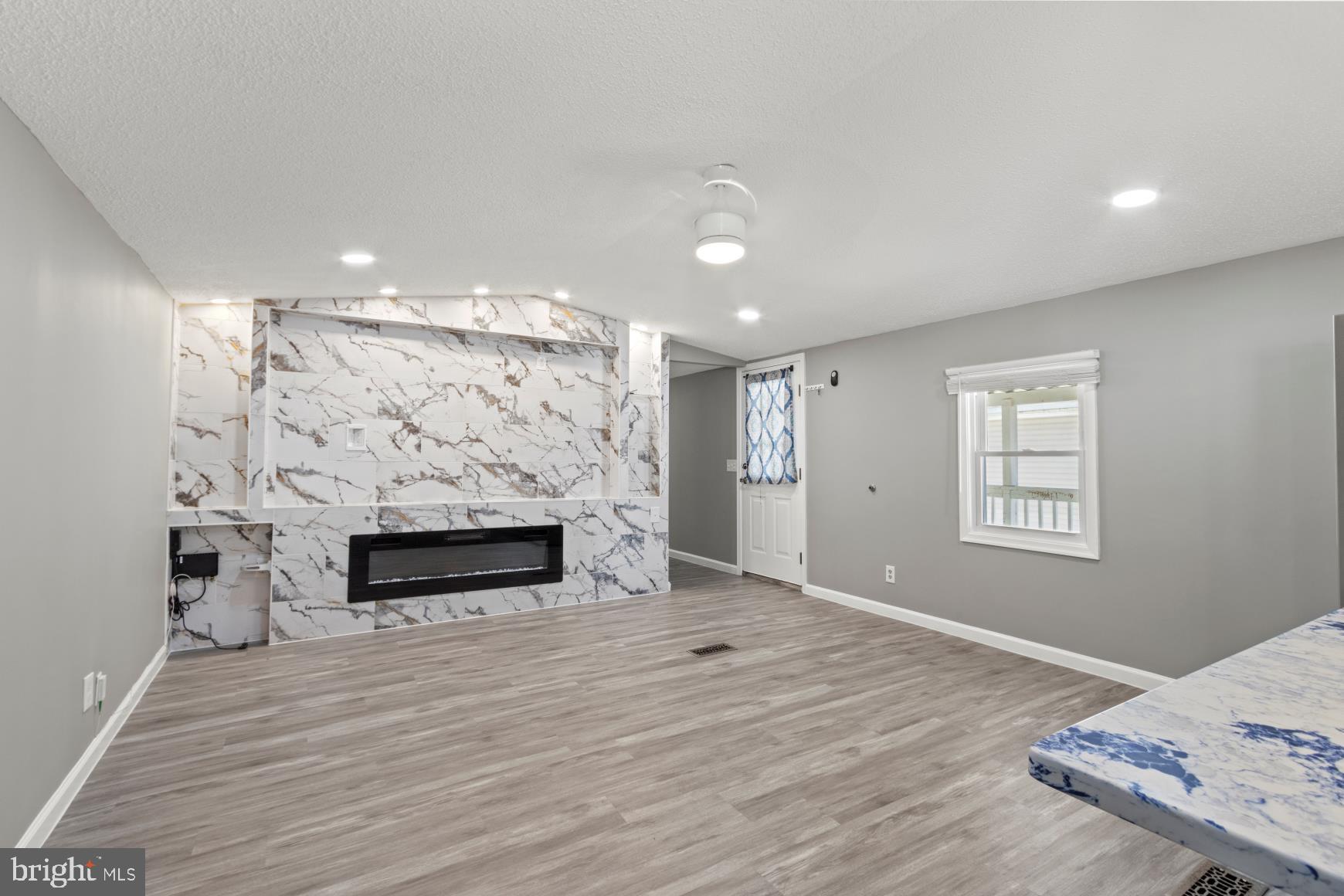 92 Patuxent Mobile Estates Lothian, MD 20711 - Photo 12 of 19 a view of a livingroom with a fireplace
