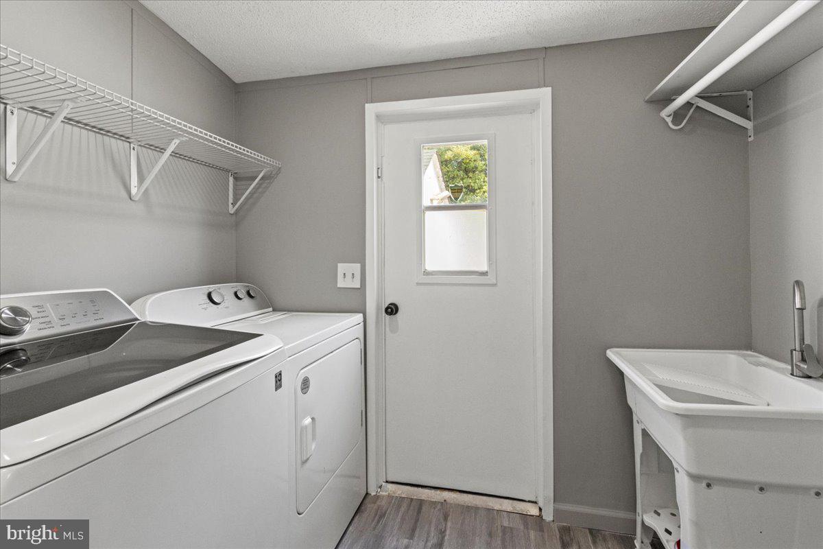 92 Patuxent Mobile Estates Lothian, MD 20711 - Photo 16 of 19 a utility room with dryer and washer