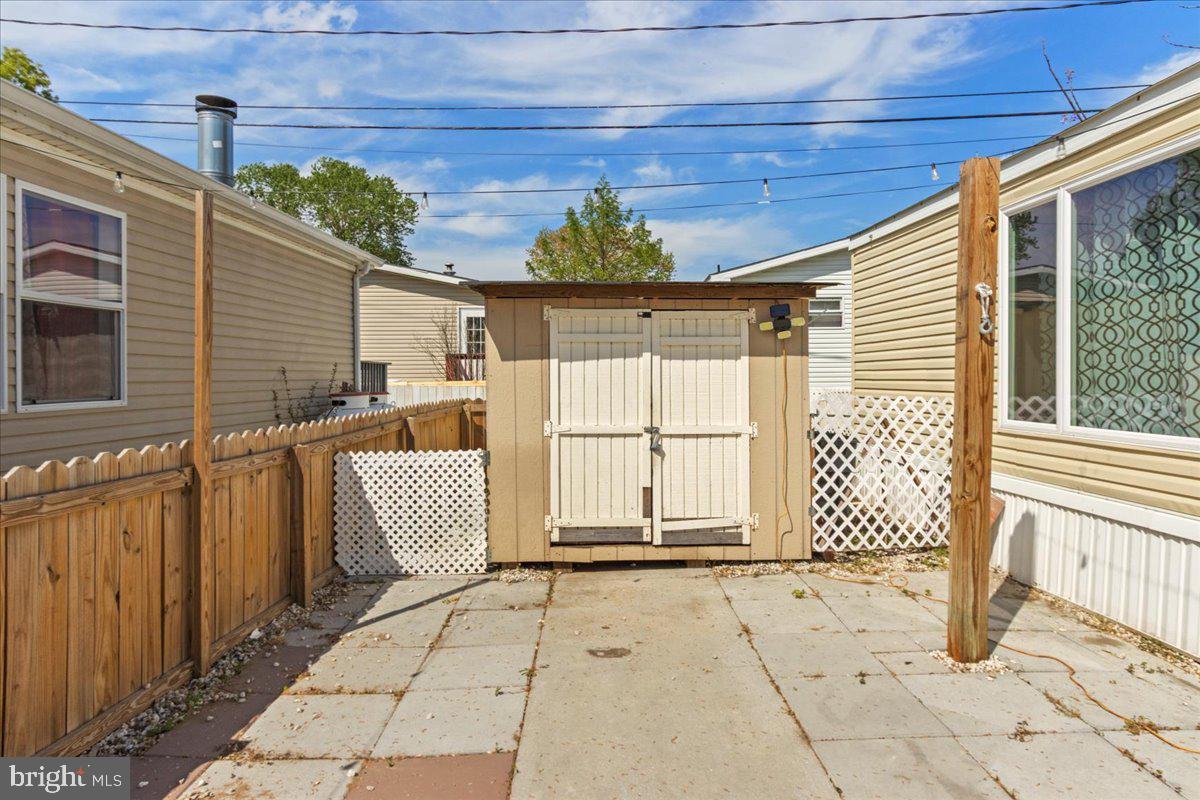 92 Patuxent Mobile Estates Lothian, MD 20711 - Photo 19 of 19 a view of a house with wooden floor and a window