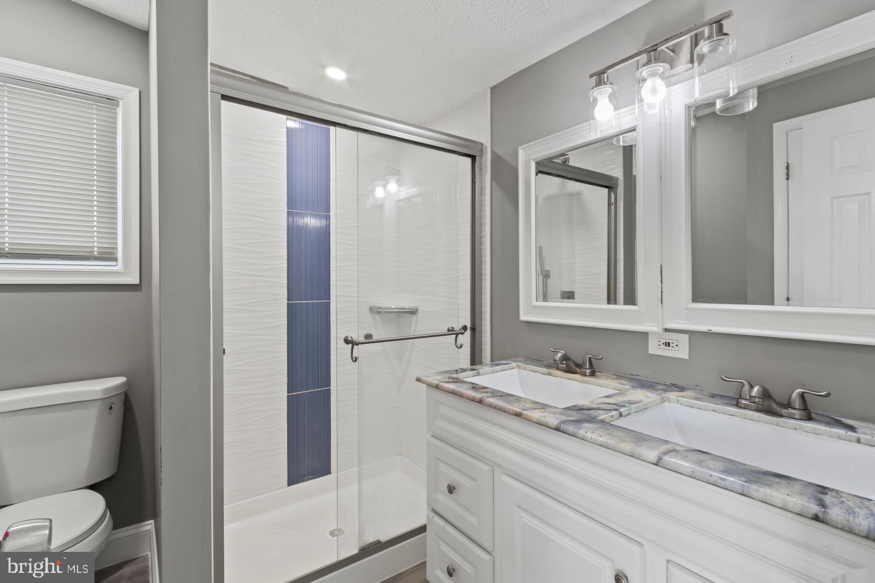 92 Patuxent Mobile Estates Lothian, MD 20711 - Photo 8 of 19 a bathroom with a granite countertop sink toilet and shower
