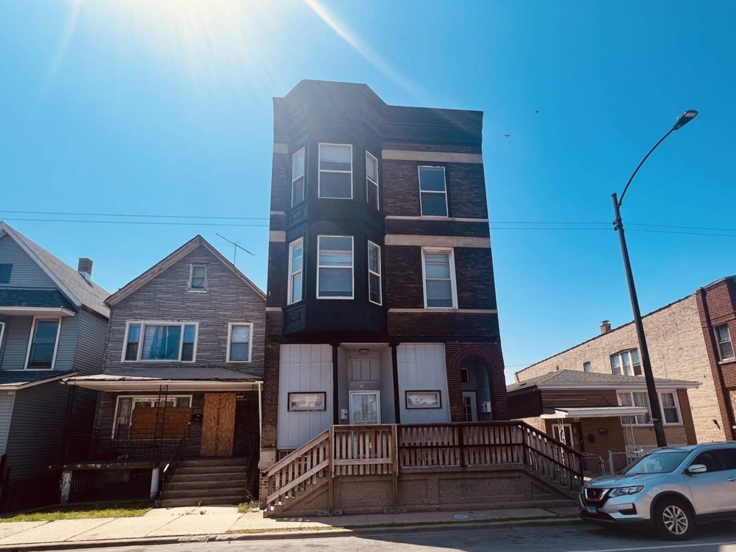 a front view of a house with parking space