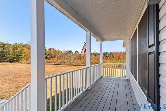 a view of a balcony with wooden floor