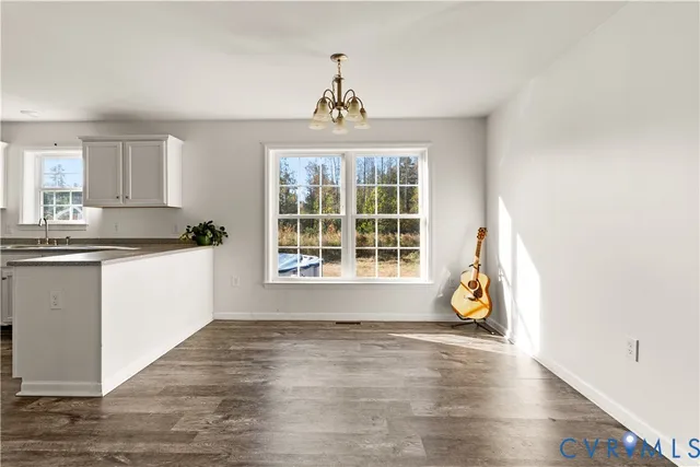 a view of a kitchen with a sink and a window