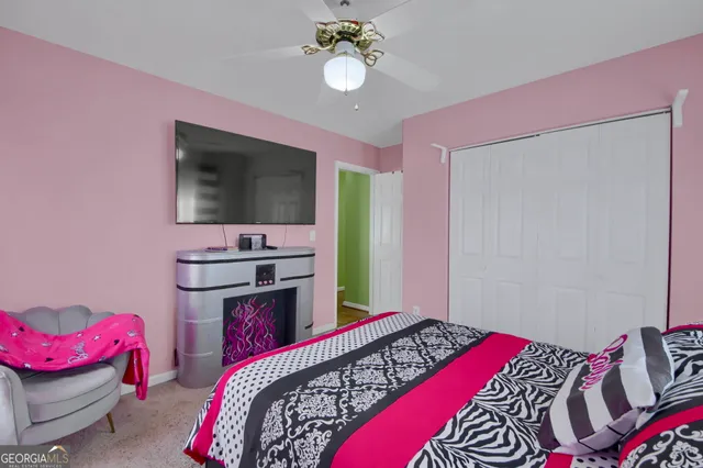 a bathroom with a granite countertop sink toilet and a mirror