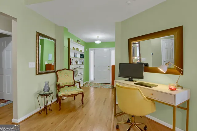 a living room with furniture fireplace and a flat screen tv