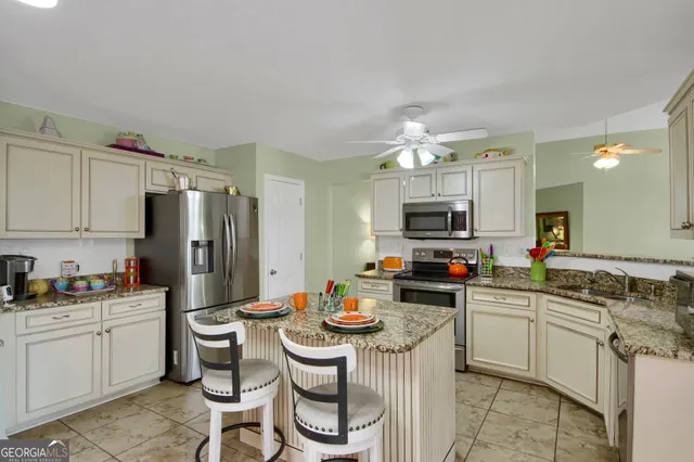 a kitchen with sink and cabinets