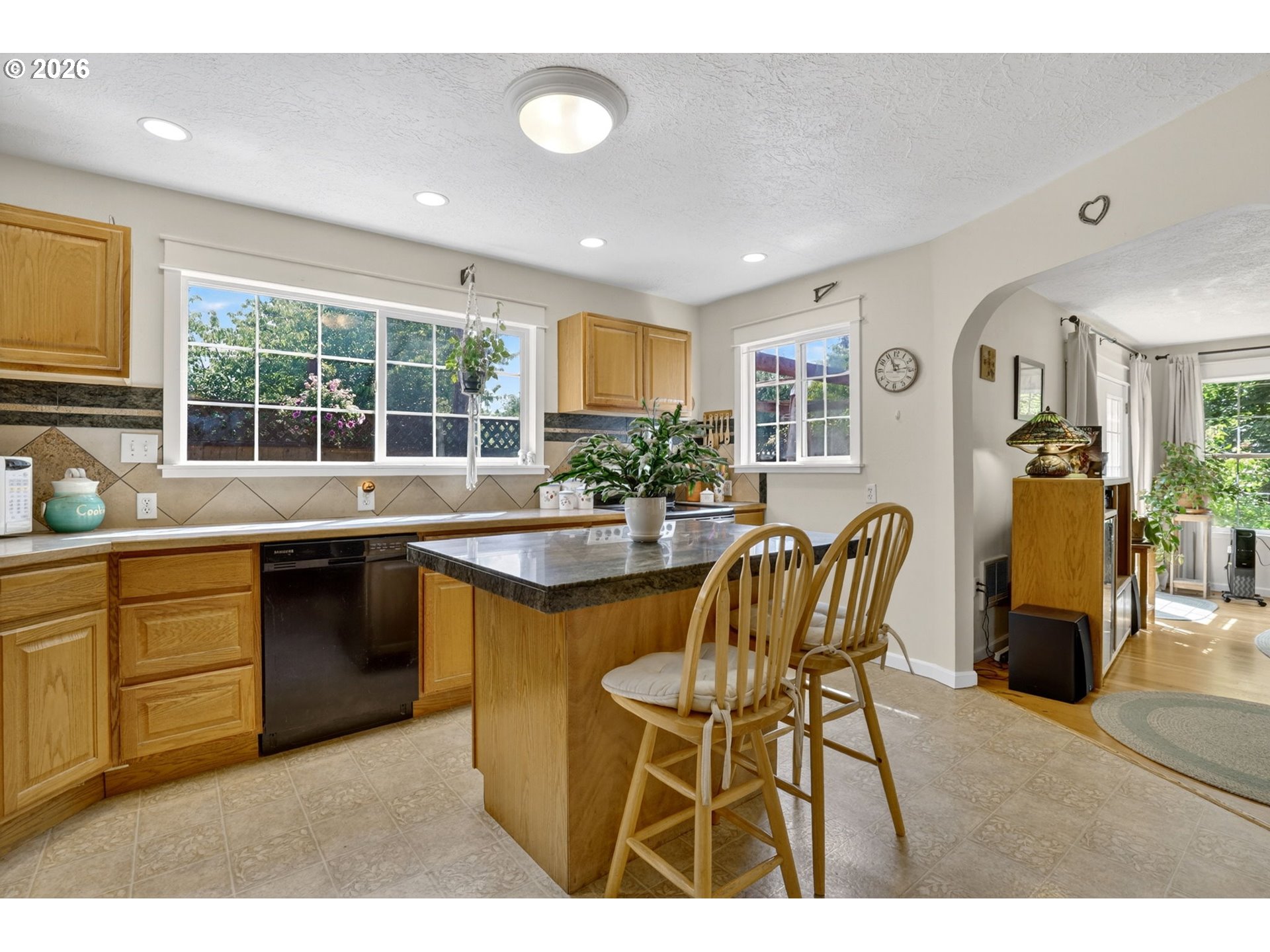 33951 Southeast Coupland Road Estacada, OR 97023 - Photo 6 of 48 a kitchen with a table chairs sink and cabinets