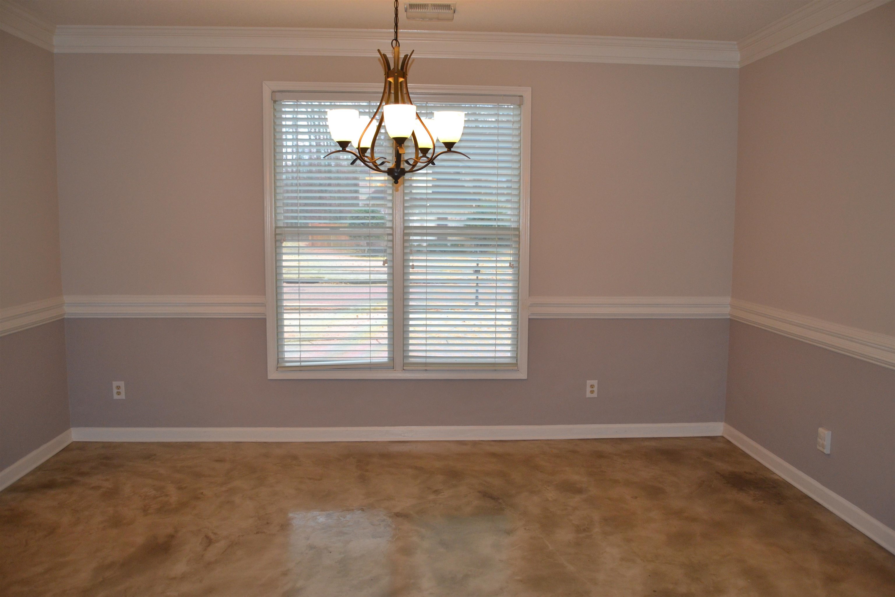 10486 Juneau Way Collierville, TN 38017 - Photo 2 of 33 Carpeted spare room with an inviting chandelier and ornamental molding