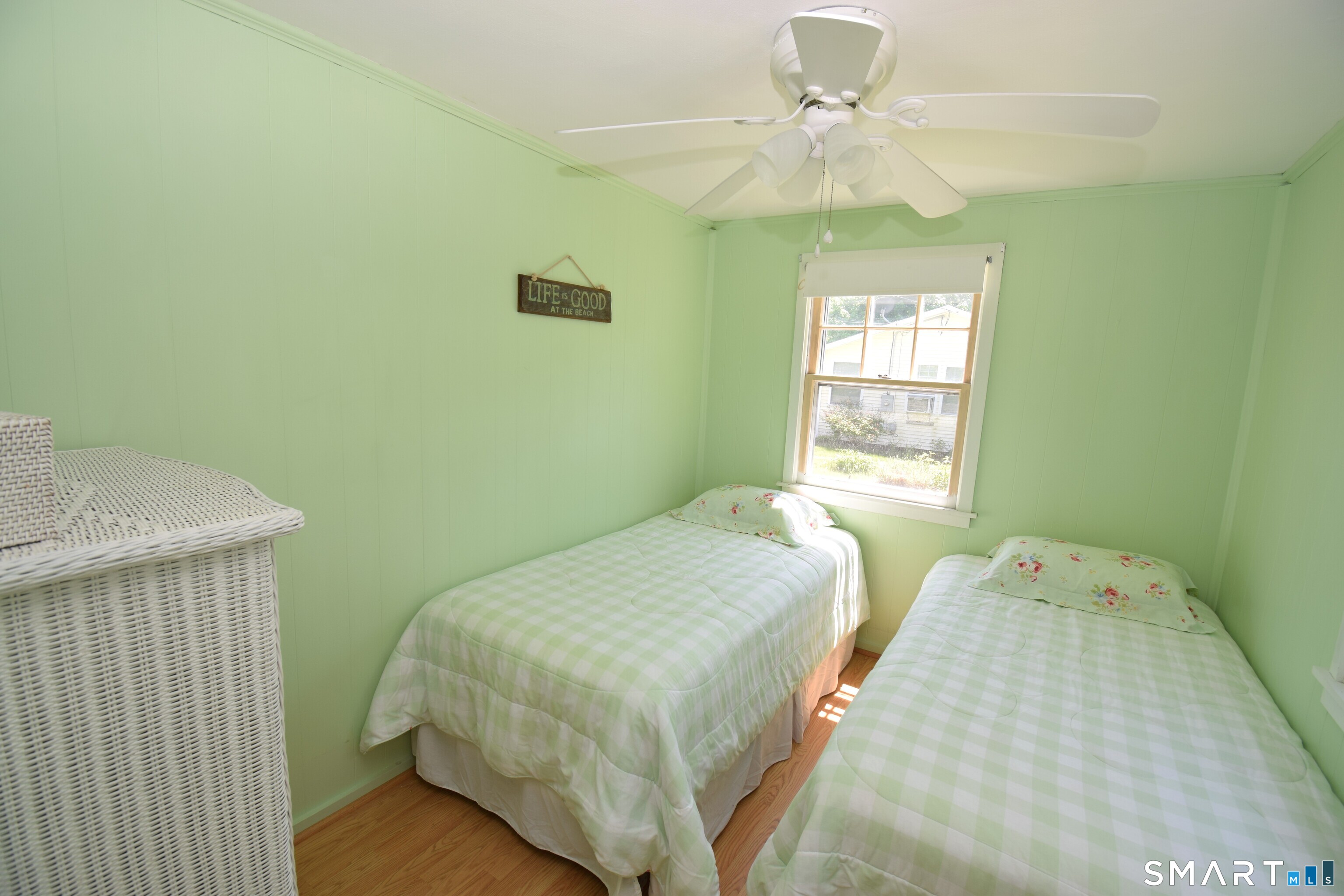 50 East Street Madison, CT 06443 - Photo 17 of 26 a bedroom with a bed and a chandelier