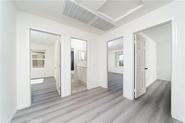 wooden floor with white walls