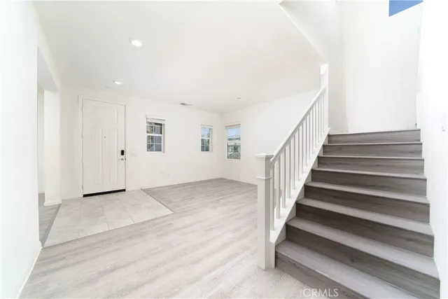 a view of entryway with wooden floor