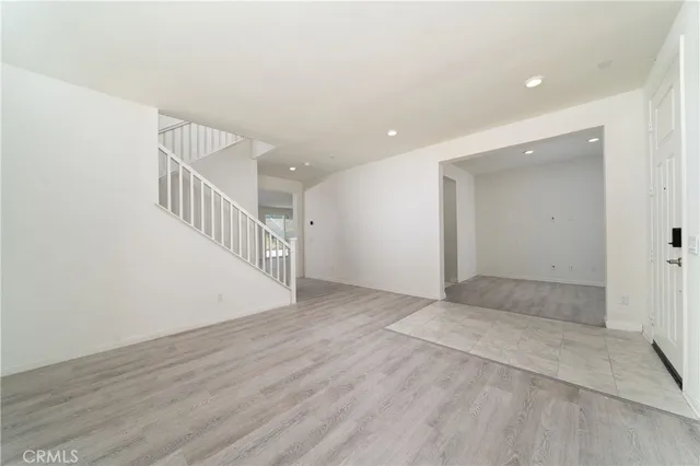 a view of an entryway with wooden floor