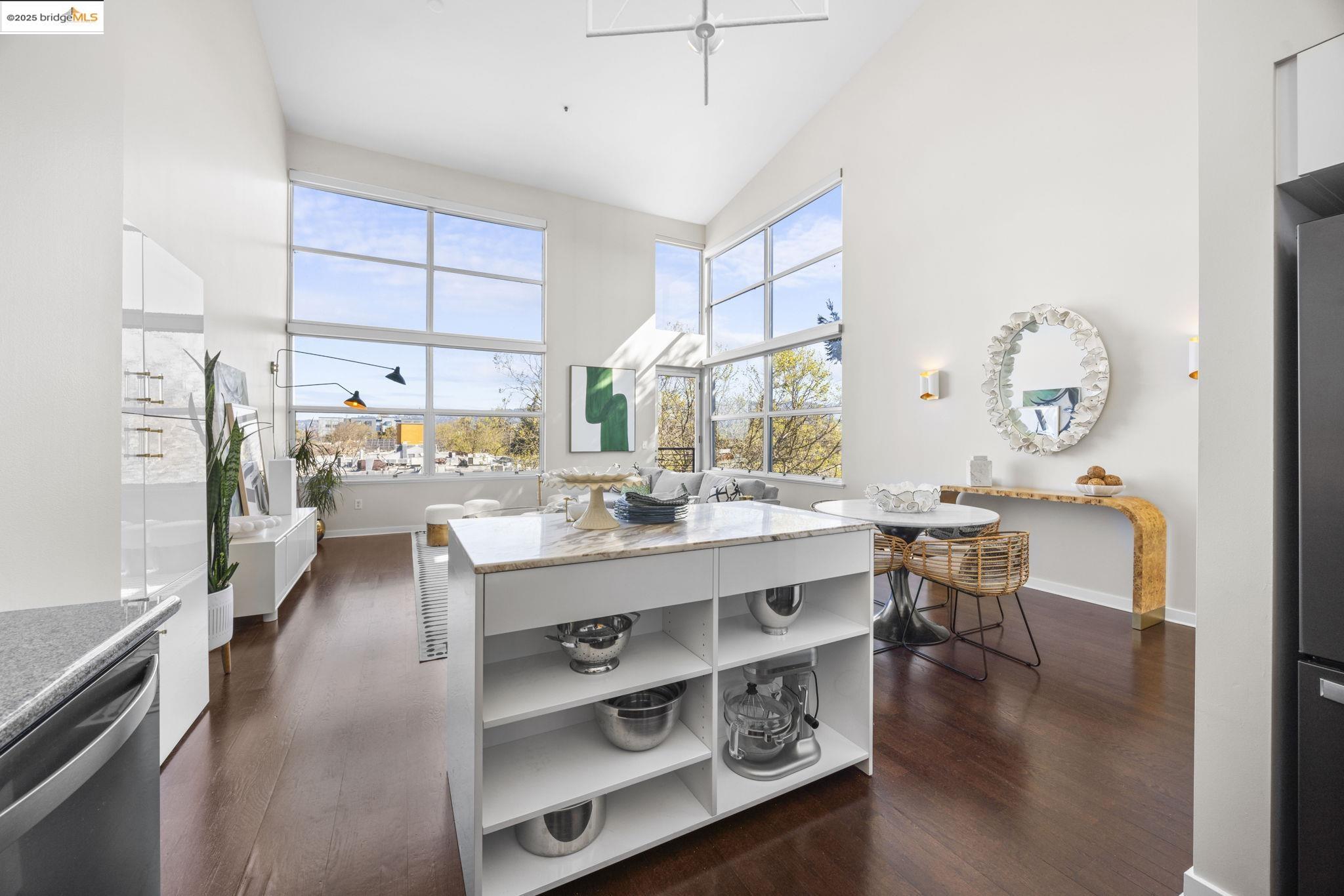 1007 41st Street, Unit 334 Oakland, CA 94608 - Photo 14 of 59 a large kitchen with a large counter top space and stainless steel appliances