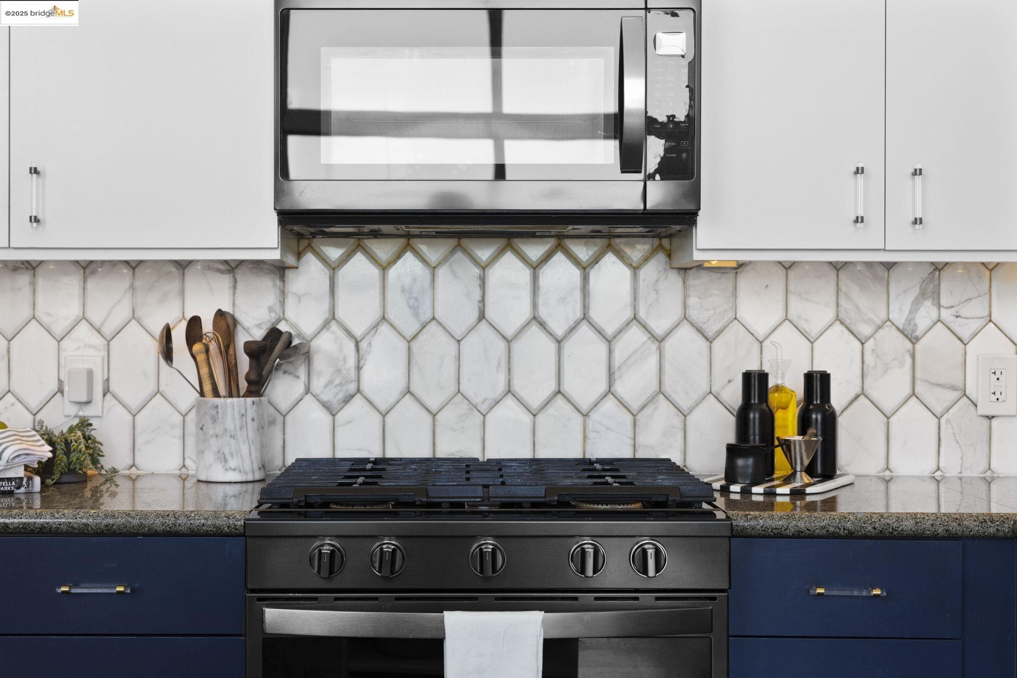 1007 41st Street, Unit 334 Oakland, CA 94608 - Photo 17 of 59 a stove top oven sitting inside of a kitchen