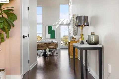 a view of living room kitchen and entryway