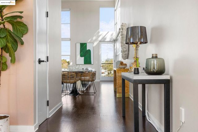 a view of living room kitchen and entryway