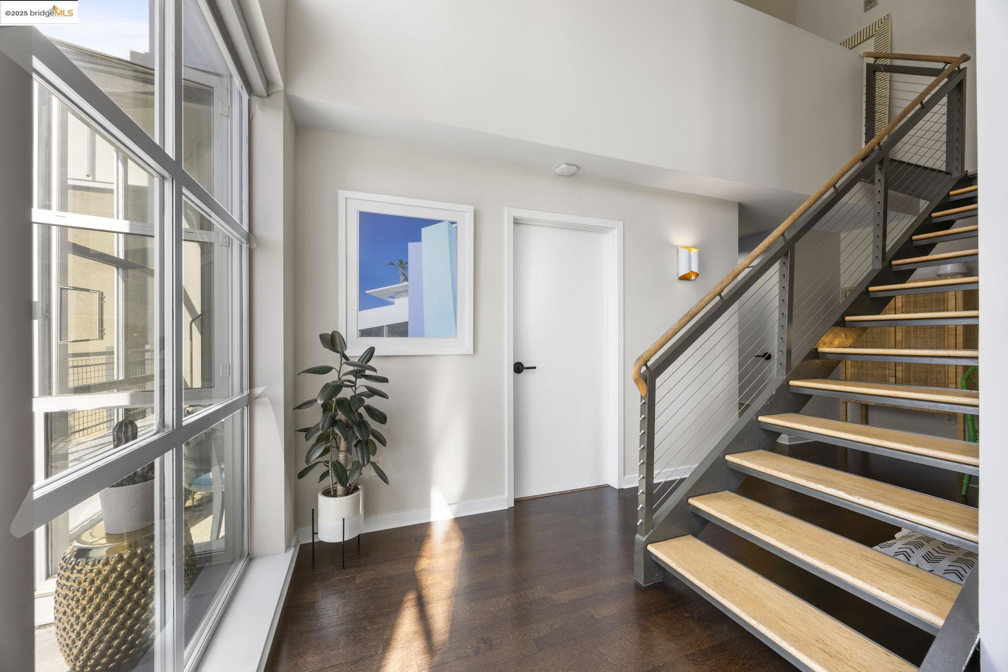 1007 41st Street, Unit 334 Oakland, CA 94608 - Photo 33 of 59 a view of entryway with wooden floor and front door
