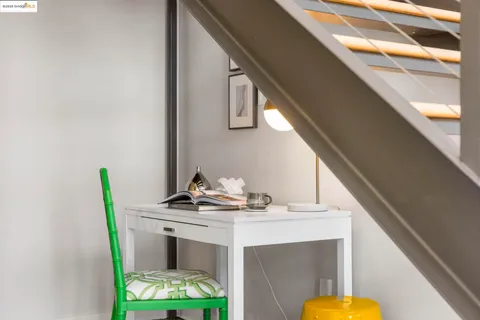 a bedroom with furniture and a window