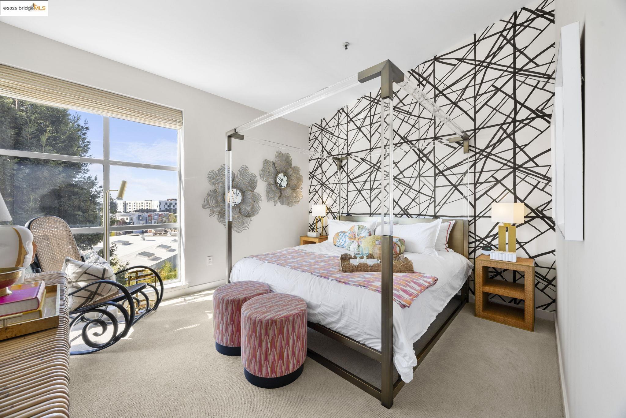 1007 41st Street, Unit 334 Oakland, CA 94608 - Photo 37 of 59 a bedroom with a bed and a table with wooden floor