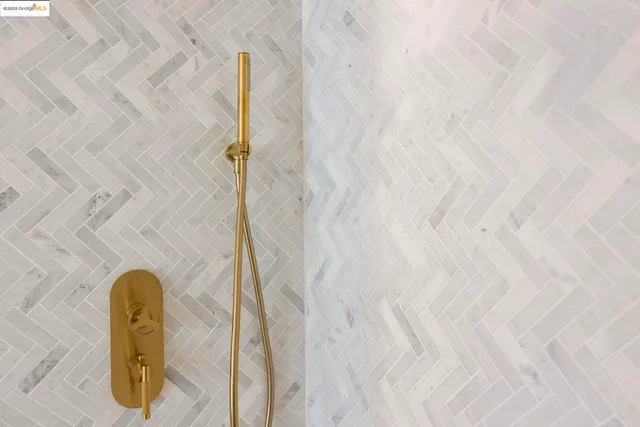 a view of a street with potted plants