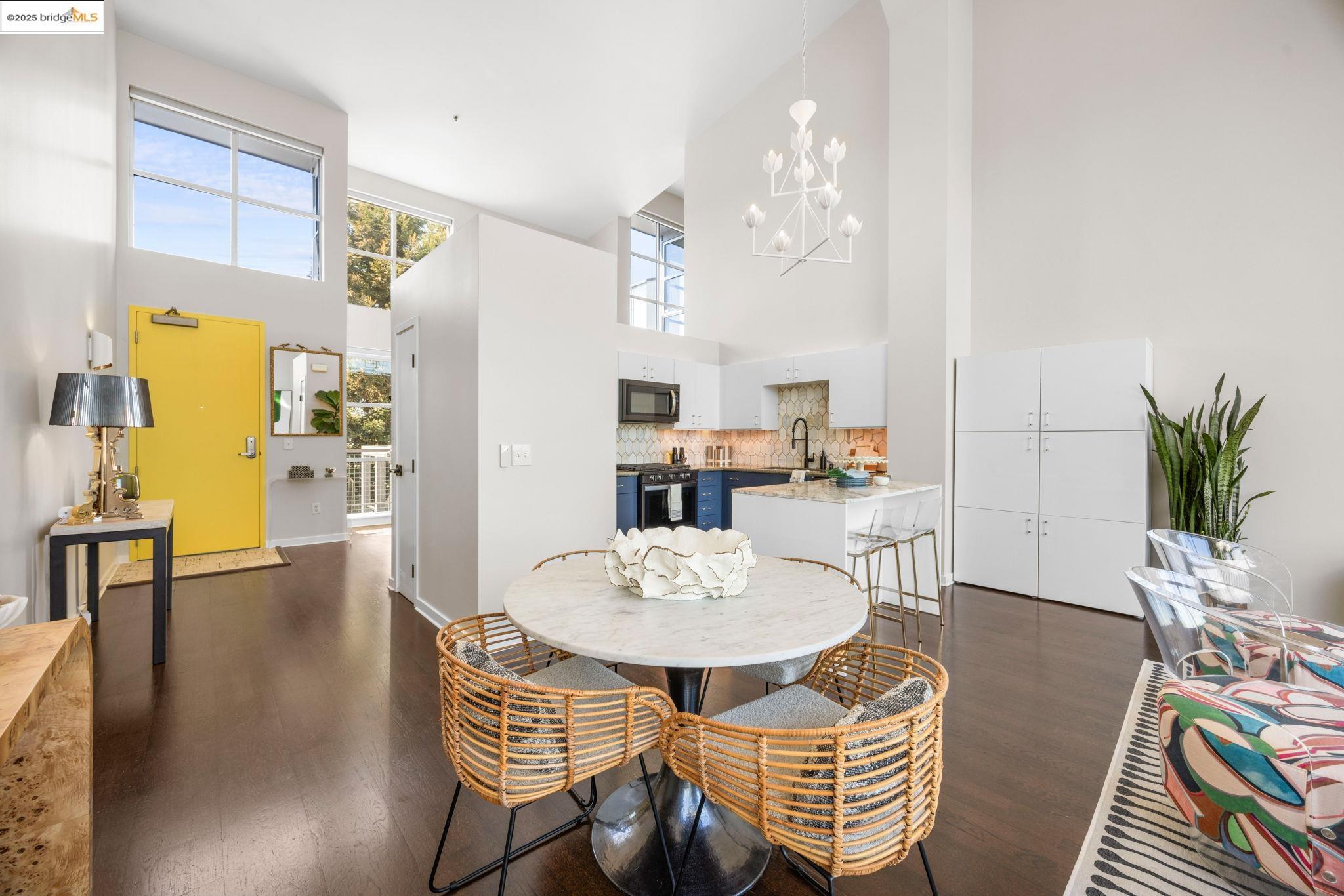 1007 41st Street, Unit 334 Oakland, CA 94608 - Photo 10 of 59 a view of a dining room with furniture and wooden floor
