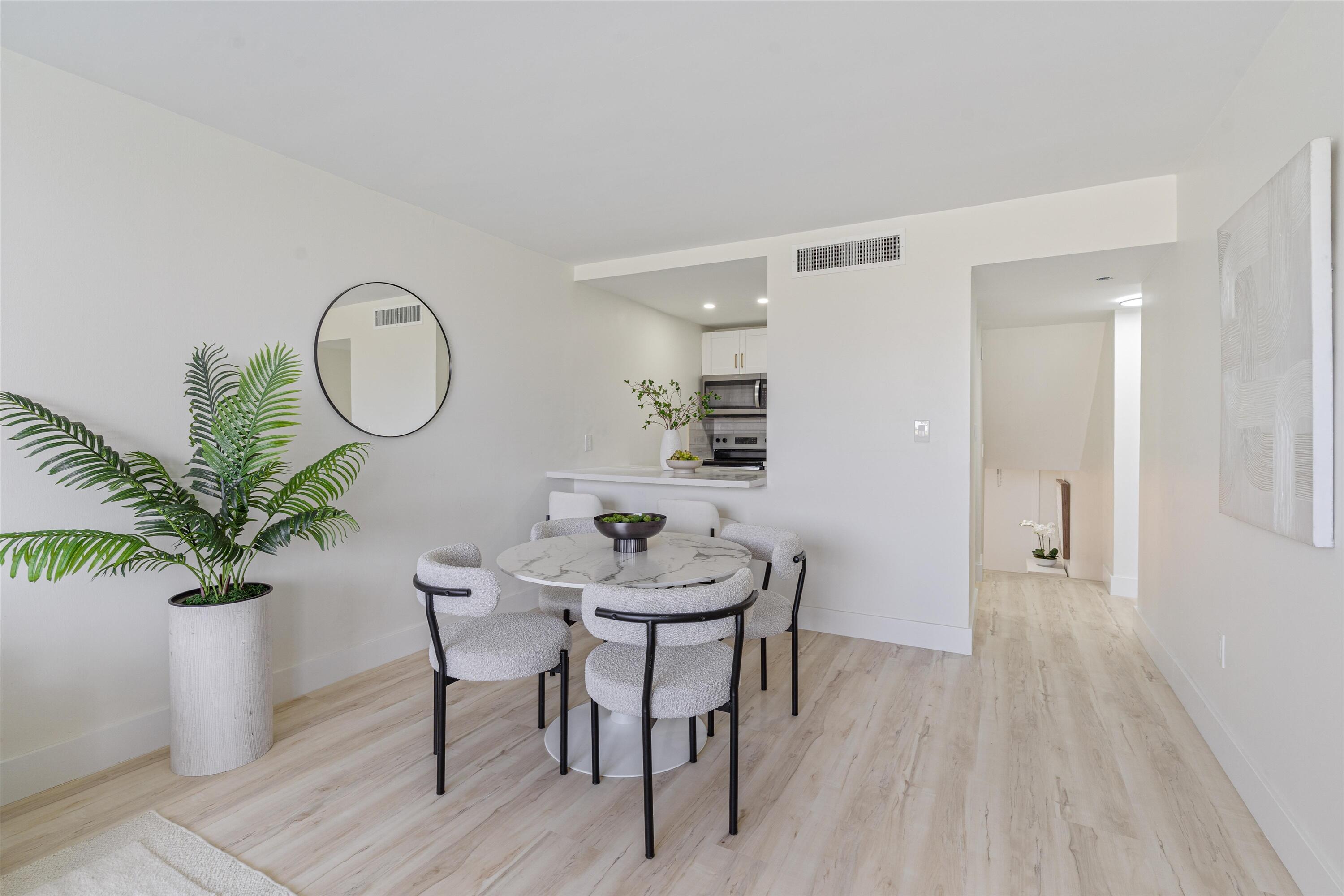 755 Dotterel Road, Unit 1307 Delray Beach, FL 33444 - Photo 12 of 36 a view of a room with furniture and wooden floor