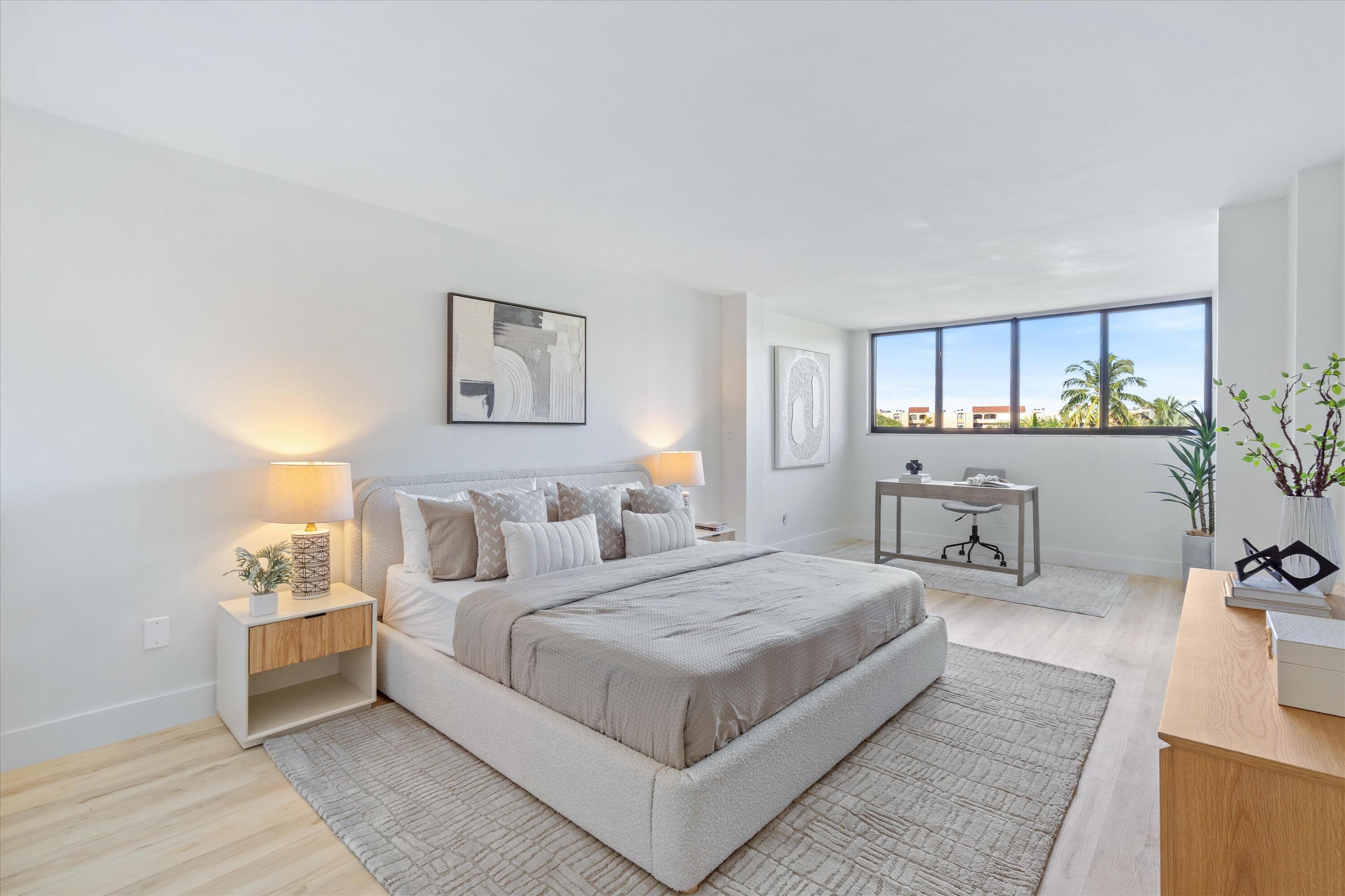 755 Dotterel Road, Unit 1307 Delray Beach, FL 33444 - Photo 14 of 36 a bedroom with a bed and white walls