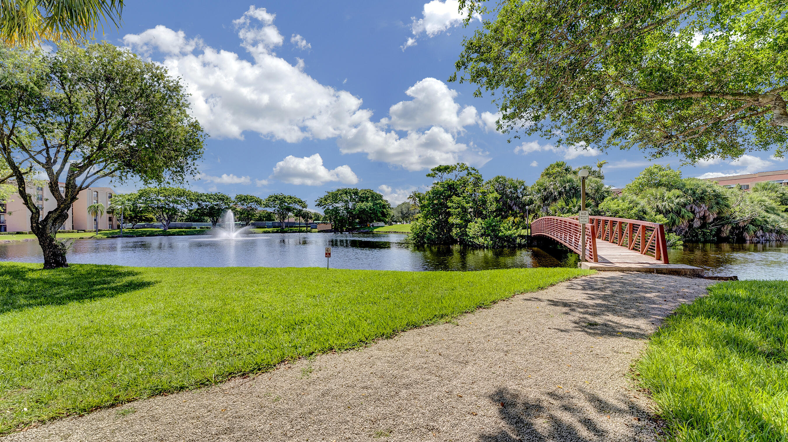 755 Dotterel Road, Unit 1307 Delray Beach, FL 33444 - Photo 32 of 36 a front view of a house with garden