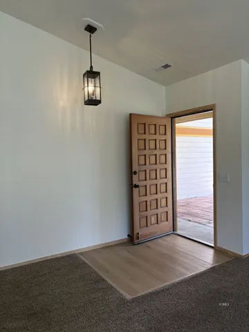a view of an empty room with a window
