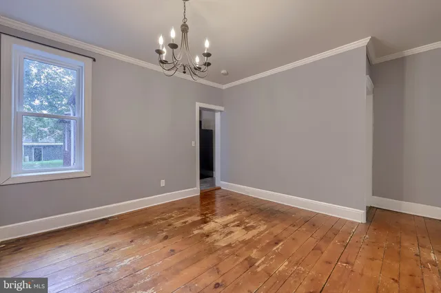 a kitchen with stainless steel appliances granite countertop a sink a stove and cabinets