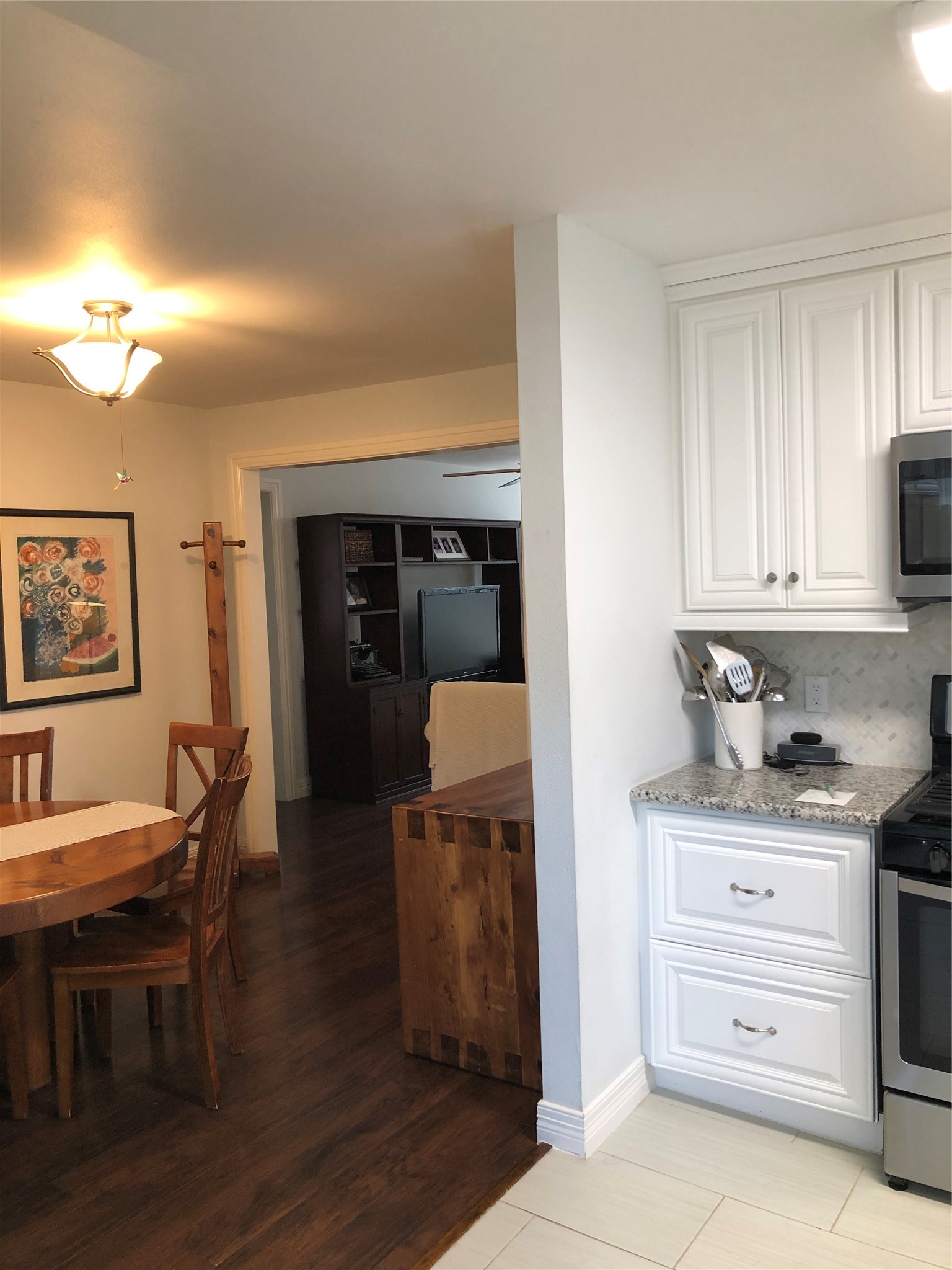 4416 Holt Street Bellaire, TX 77401 - Photo 11 of 12 a kitchen with a stove and cabinets