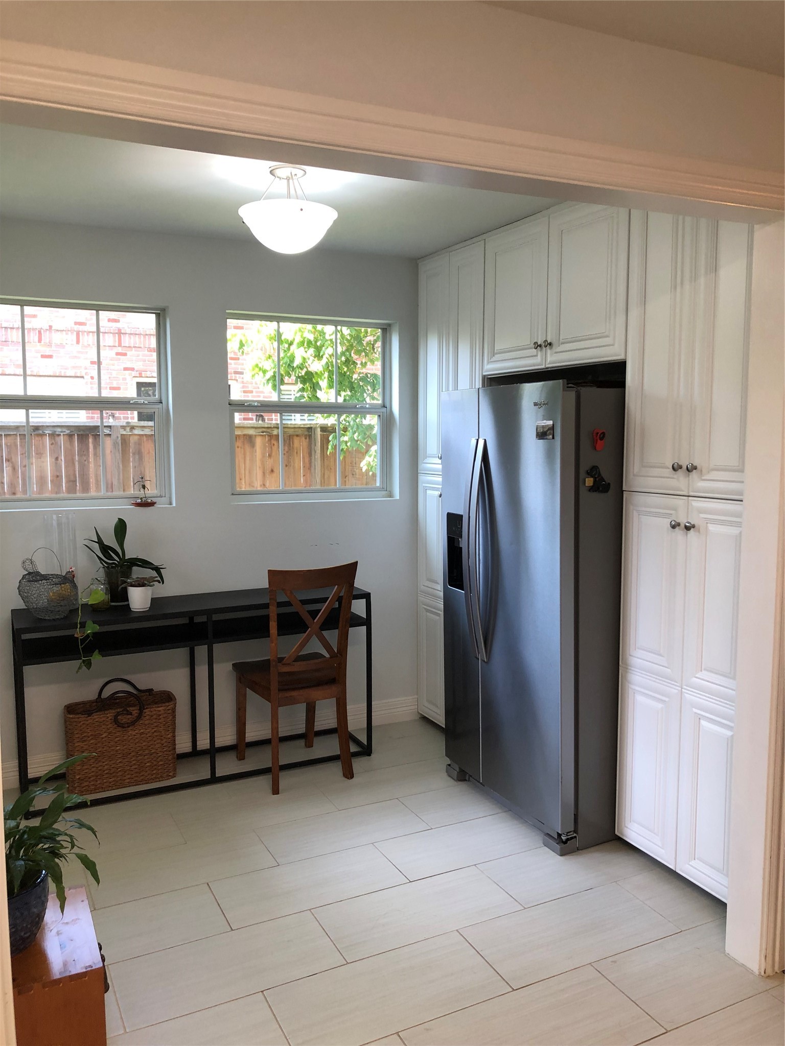 4416 Holt Street Bellaire, TX 77401 - Photo 3 of 12 a kitchen with stainless steel appliances granite countertop a refrigerator and a sink