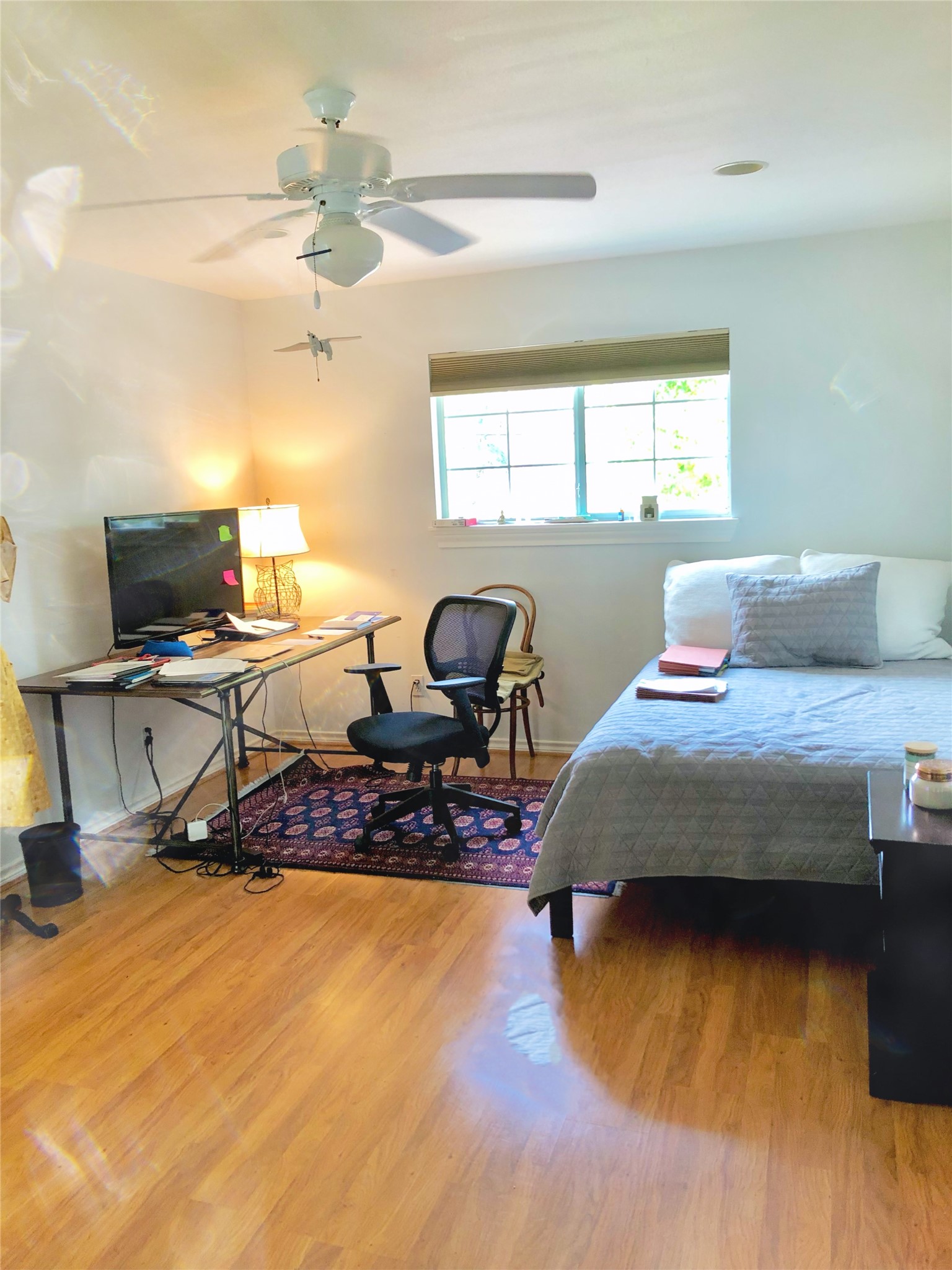 4416 Holt Street Bellaire, TX 77401 - Photo 8 of 12 a bedroom with a bed and a window