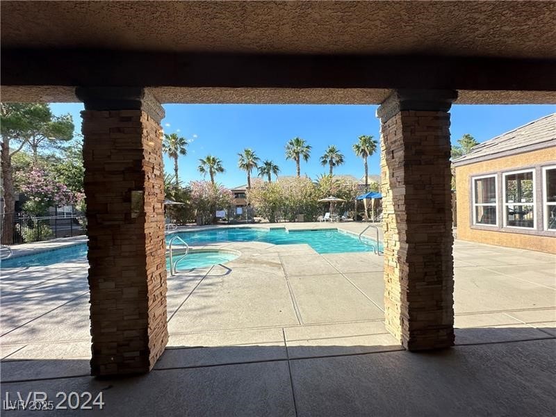6650 West Warm Springs Road, Unit 2007 Las Vegas, NV 89118 - Photo 25 of 26 Community pool with a patio