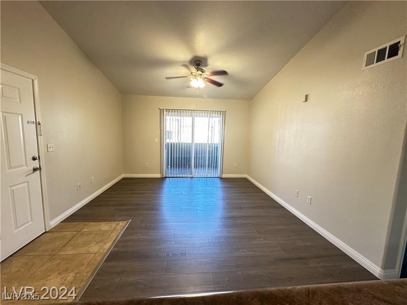 6650 West Warm Springs Road, Unit 2007 Las Vegas, NV 89118 - Photo 8 of 26 Unfurnished room featuring dark wood finished floors and ceiling fan