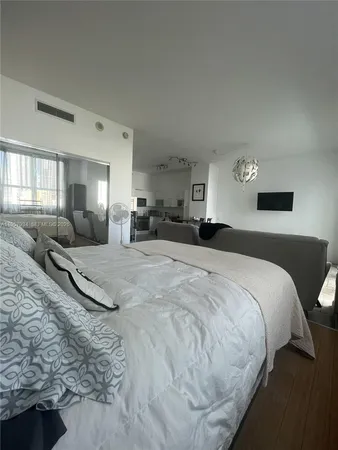 a bedroom with a couch and a couch