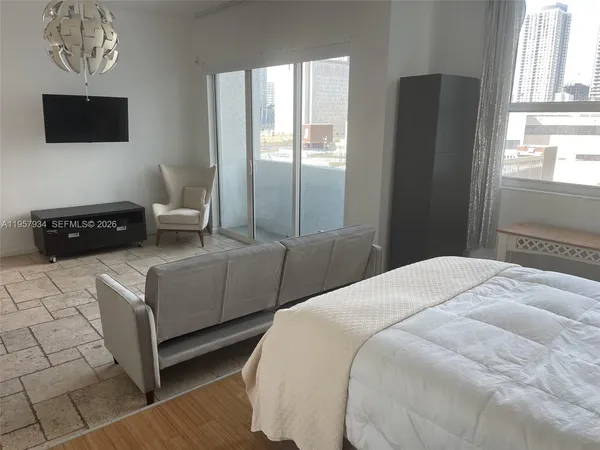 a kitchen with stainless steel appliances granite countertop a refrigerator and a stove