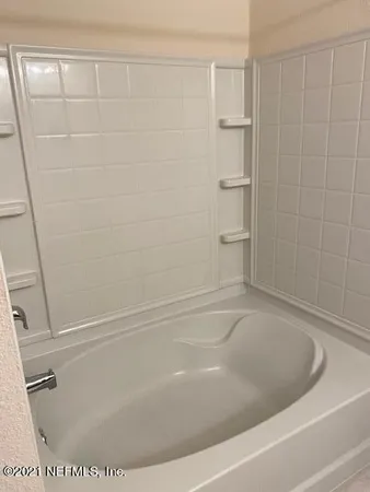 a bathroom with a bathtub