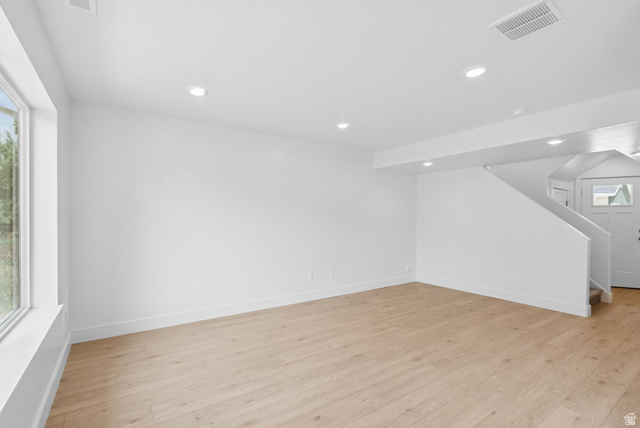1617 North Angel Street Layton, UT 84041 - Photo 14 of 43 Unfurnished living room featuring stairs, light wood-style flooring, and recessed lighting