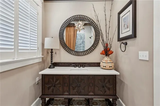 a bathroom with a sink and a mirror