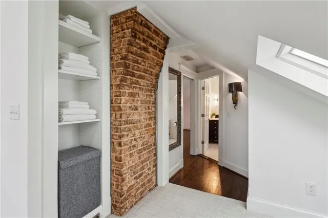 a view of entryway with a rug and a floor to ceiling window